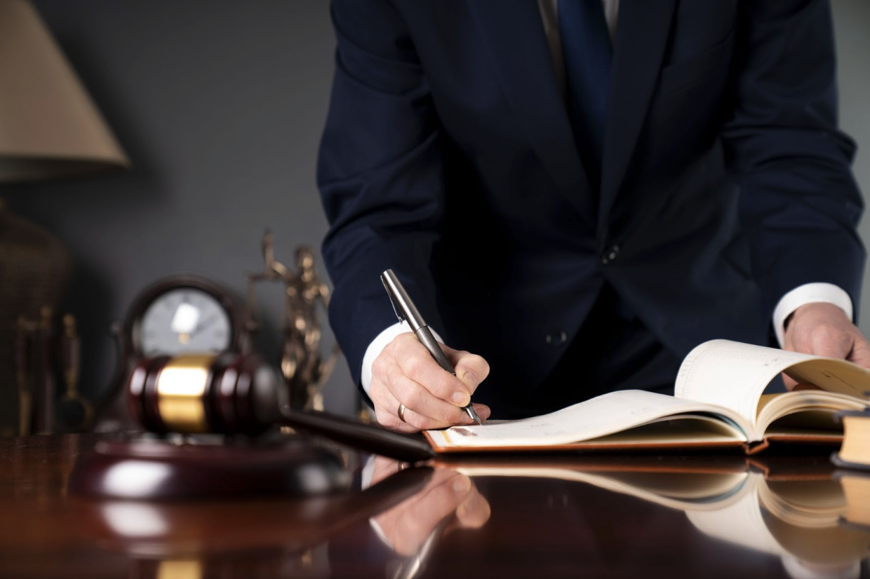 Lawyer writing at a desk